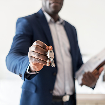 a property manager handing over the keys to a property